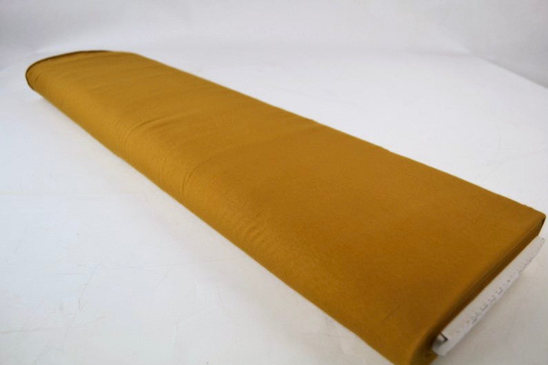 MØRK KARRYGUL BOMULDSJERSEY – NATURLIG, ÅNDBAR & STRÆKBAR