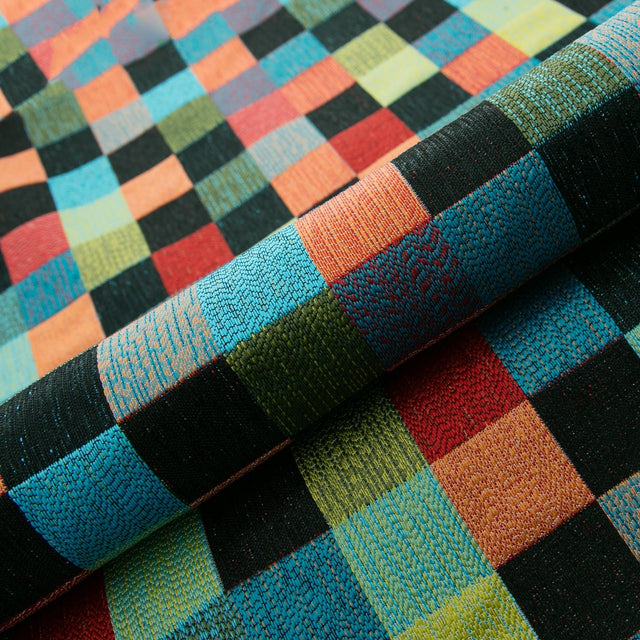 TURKIS-ORANGE KONFETTI-TERN PÅ SORT BARCELONA JACQUARD DEKORATIONSSTOF – KONFETTI-TERN