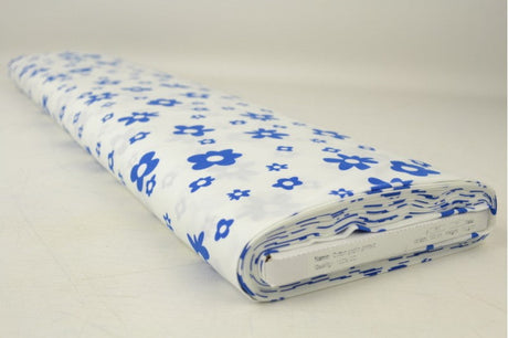 CREME BOMULDSPOPLIN MED BLOMSTERPRINT – MARINEBLÅ