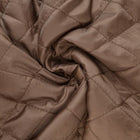 BRUN QUILT STOF MED VATTERET BAGSIDE